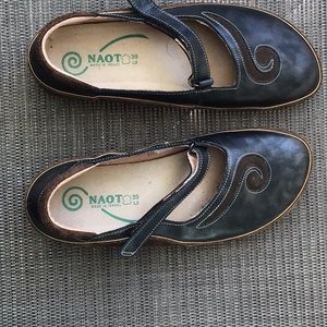 Naot two tone brown shoes.